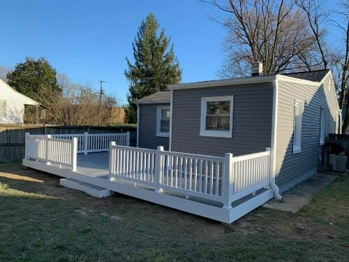 New deck on blue house with white trim