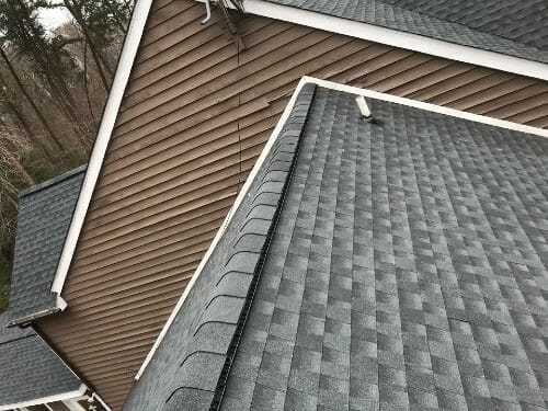Side shot of beautiful new asphalt shingle roof